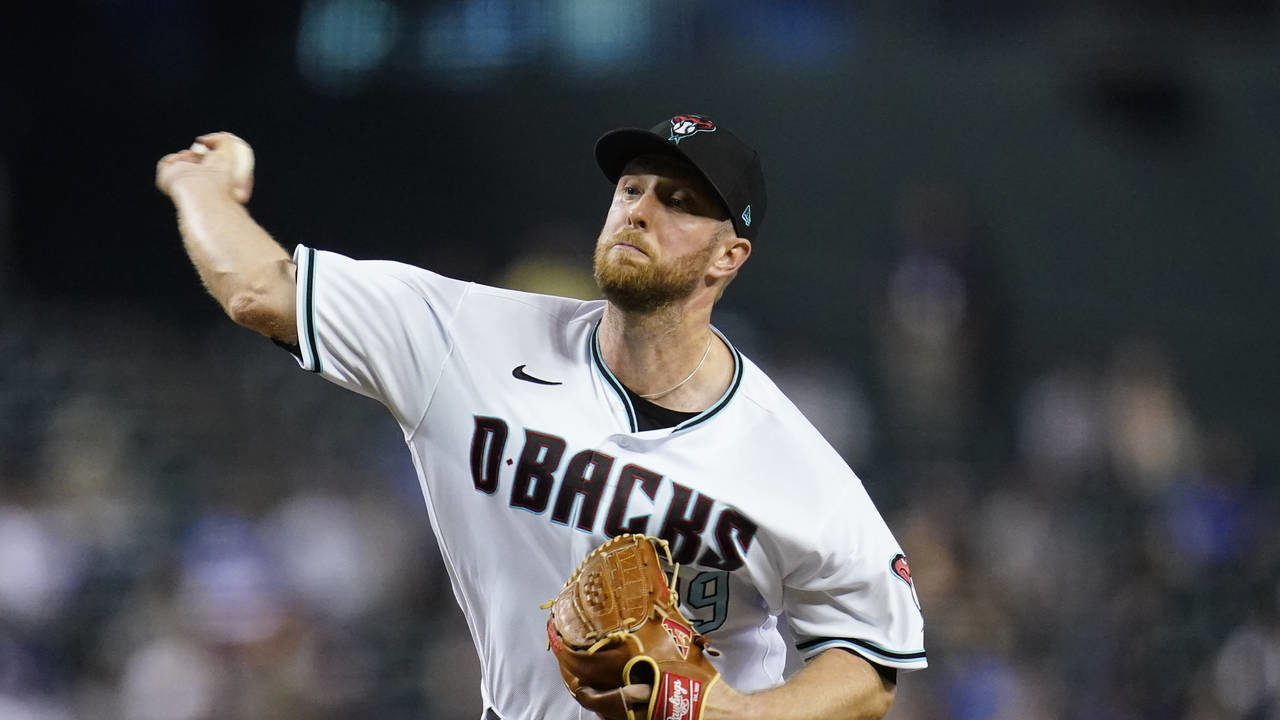 Arizona Diamondbacks starting pitcher Merrill Kelly throws to a Los Angeles Dodgers batter during t...