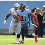 Tennessee Titans safety Kevin Byard (31) runs back a pass interception against the Las Vegas Raiders in the second half of an NFL football game Sunday, Sept. 25, 2022, in Nashville, Tenn. (AP Photo/Mark Zaleski)