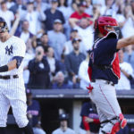 New York Yankees' Aaron Judge reacts after striking out against as Boston Red Sox catcher Reese McGuire throws the ball during the seventh inning of a baseball game Saturday, Sept. 24, 2022, in New York. (AP Photo/Jessie Alcheh)