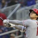 
              Los Angeles Angels Shohei Ohtani flies out during the first inning of the team's baseball game against the Minnesota Twins on Saturday, Sept. 24, 2022, in Minneapolis. (AP Photo/Andy Clayton-King)
            