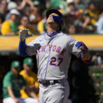 New York Mets' Mark Vientos looks up as he crosses home plate after hitting a solo home run against the Oakland Athletics during the second inning of a baseball game in Oakland, Calif., Saturday, Sept. 24, 2022. (AP Photo/Tony Avelar)