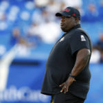 
              Northern Illinois head coach Thomas Hammock watches his team warm up before an NCAA college football game against Kentucky in Lexington, Ky., Saturday, Sept. 24, 2022. (AP Photo/Michael Clubb)
            