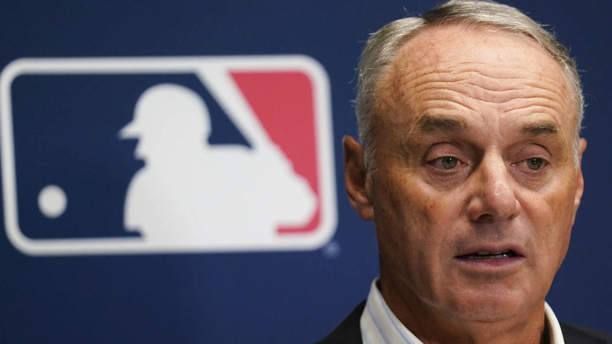 FILE - Major League Baseball Commissioner Rob Manfred speaks to reporters following an owners' meet...