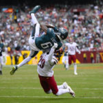Philadelphia Eagles wide receiver DeVonta Smith (6) makes a catch against Washington Commanders cornerback Kendall Fuller (29) during the first half of an NFL football game, Sunday, Sept. 25, 2022, in Landover, Md. (AP Photo/Nick Wass)