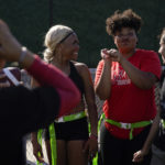 
              Sa'Mir Braccey, 17, center left, and Lauren Ferguson, 17, center right, share a laugh as they and other Redondo Union High School girls try out for a flag football team on Thursday, Sept. 1, 2022, in Redondo Beach, Calif. Southern California high school sports officials will meet on Thursday, Sept. 29, to consider making girls flag football an official high school sport. This comes amid growth in the sport at the collegiate level and a push by the NFL to increase interest. (AP Photo/Ashley Landis)
            