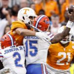 Florida quarterback Anthony Richardson (15) is hit by Tennessee defensive lineman Tyler Baron, top left, during the second half of an NCAA college football game Saturday, Sept. 24, 2022, in Knoxville, Tenn. (AP Photo/Wade Payne)
