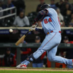 Minnesota Twins' Jose Miranda hits an RBI double against the Chicago White Sox in the third inning of a baseball game Tuesday, Sept. 27, 2022, in Minneapolis. (AP Photo/Bruce Kluckhohn)