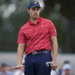 
              Patrick Cantlay stands on the fifth green during their singles match at the Presidents Cup golf tournament at the Quail Hollow Club, Sunday, Sept. 25, 2022, in Charlotte, N.C. (AP Photo/Julio Cortez)
            