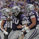 Kansas State running back Deuce Vaughn, left, celebrates with teammates after scoring a touchdown during the first half of an NCAA college football game against Missouri Saturday, Sept. 10, 2022, in Manhattan, Kan. (AP Photo/Charlie Riedel)