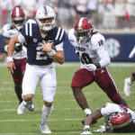 
              Mississippi quarterback Jaxson Dart (2) runs the ball during the first half an NCAA college football game against Troy in Oxford, Miss., Saturday, Sept. 3, 2022. (AP Photo/Thomas Graning)
            