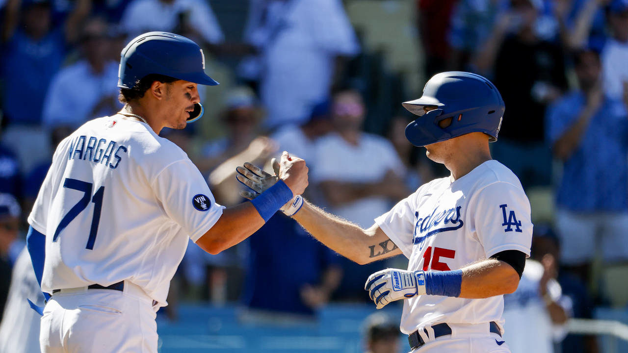 Los Angeles Dodgers catcher Austin Barnes, right, is congratulated by Miguel Vargas after his two-r...