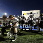 
              FILE - Permian linebacker Israel Martinez, left, and defensive lineman Tyler Tomlinson pray before a high school football game against Abilene on Friday, Oct. 17, 2014, at Shotwell Stadium in Abilene, Texas. Abilene won 30-13. A poll by The Associated Press and the NORC Center for Public Affairs Research conducted Sept. 9-12, 2022, finds that about 3 in 10 Americans say they feel God plays a role in determining which team goes home the victor. (Edyta Blaszczyk/Odessa American via AP, File)
            