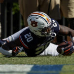 Auburn safety Cayden Bridges recovers a fumble in the end zone to secure the win over Missouri during the first overtime of an NCAA college football game, Saturday, Sept. 24, 2022 in Auburn, Ala. (AP Photo/Butch Dill)