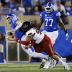 
              Kentucky quarterback Will Levis (7) is tackled by Northern Illinois defensive end Roy Williams (97) during the first half of an NCAA college football game in Lexington, Ky., Saturday, Sept. 24, 2022. (AP Photo/Michael Clubb)
            