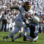 
              Penn State linebacker Abdul Carter (11) tackles Central Michigan running back Lew Nichols III (7) during the second half of an NCAA college football game, Saturday, Sept. 24, 2022, in State College, Pa. (AP Photo/Barry Reeger)
            