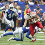 Kansas City Chiefs tight end Travis Kelce (87) is tackled by Indianapolis Colts' Rodney Thomas II (25) during the second half of an NFL football game, Sunday, Sept. 25, 2022, in Indianapolis. (AP Photo/Michael Conroy)