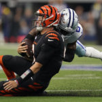 
              Cincinnati Bengals quarterback Joe Burrow (9) reacts to a late hit by Dallas Cowboys safety Donovan Wilson (6) after a scramble during the first half of an NFL football game Sunday, Sept. 18, 2022, in Arlington, Tx. (AP Photo/Tony Gutierrez)
            
