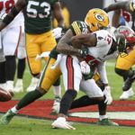 
              Green Bay Packers' Rasul Douglas hits Tampa Bay Buccaneers' Russell Gage and forces a fumble during the second half of an NFL football game Sunday, Sept. 25, 2022, in Tampa, Fla. (AP Photo/Jason Behnken)
            