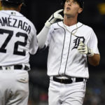 
              Detroit Tigers' Kerry Carpenter, right, reacts after hitting a single against the Kansas City Royals in the sixth inning of a baseball game, Saturday, Sept. 3, 2022, in Detroit. Tigers first base coach Alfredo Amézaga, left, looks on. (AP Photo/Jose Juarez)
            