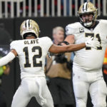 
              New Orleans Saints wide receiver Chris Olave (12) celebrates his touchdown against the Atlanta Falcons during the second half of an NFL football game, Sunday, Sept. 11, 2022, in Atlanta. (AP Photo/Brynn Anderson)
            
