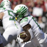 
              Oregon running back Mar'Keise Irving carries the ball during the first half of an NCAA college football game against Washington State, Saturday, Sept. 24, 2022, in Pullman, Wash. (AP Photo/Young Kwak)
            