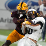 Arizona State defensive back Ro Torrence tackles Northern Arizona wide receiver Coleman Owen (6) during the first half of an NCAA college football game Thursday, Sept. 1, 2022, in Tempe, Ariz. (AP Photo/Rick Scuteri)