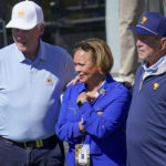 Former President's Bill Clinton, left, and George W. Bush pose for a photo with Charlotte Mayor Vi Lyles during a fourball match at the Presidents Cup golf tournament at the Quail Hollow Club, Friday, Sept. 23, 2022, in Charlotte, N.C. (AP Photo/Julio Cortez)