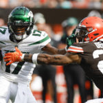
              New York Jets wide receiver Garrett Wilson tries to break away from Cleveland Browns safety Grant Delpit (22) during the second half of an NFL football game, Sunday, Sept. 18, 2022, in Cleveland. The Jets won 31-30. (AP Photo/Ron Schwane)
            
