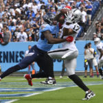 
              Las Vegas Raiders wide receiver Davante Adams (17) catches a touchdown pass over Tennessee Titans safety Kevin Byard in the first half of an NFL football game Sunday, Sept. 25, 2022, in Nashville, Tenn. (AP Photo/John Amis)
            