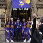 
              Cheerleaders for the The Minnesota Vikings NFL team pose for pictures with a supporter of the team at a fan interaction event at The Brotherhood Of Pursuits And Pastimes sports bar in Manchester, England, Wednesday, Sept. 28, 2022. A half-dozen NFL teams are aggressively targeting fans in Britain now that they have new marketing rights in the country. They’re signing commercial deals and hiring local media personalities in bids to expand their fanbases and tap international revenue.(AP Photo/Jon Super)
            