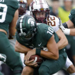 
              Michigan State quarterback Payton Thorne (10) is sacked by Minnesota's Ryan Stapp (22) during the first quarter of an NCAA college football game, Saturday, Sept. 24, 2022, in East Lansing, Mich. (AP Photo/Al Goldis)
            