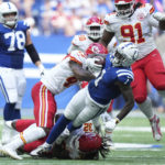 Indianapolis Colts' Parris Campbell (1) is tackled by Kansas City Chiefs' Nick Bolton (32) and Darius Harris (47) during the second half of an NFL football game, Sunday, Sept. 25, 2022, in Indianapolis. (AP Photo/AJ Mast)
