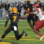 Arizona State defensive back Timarcus Davis intercepts a pass intended for Utah wide receiver Solomon Enis (21) during the second half of an NCAA college football game, Saturday, Sept. 24, 2022, in Tempe, Ariz. (AP Photo/Rick Scuteri)
