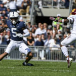 Penn State wide receiver Mitchell Tinsley (5) looks to elude Central Michigan defensive back Donte Kent (4) during the second half of an NCAA college football game, Saturday, Sept. 24, 2022, in State College, Pa. (AP Photo/Barry Reeger)