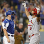 
              CORRECTS TO ST. LOUIS CARDINALS' ALBERT PUJOLS, INSTEAD OF LOS ANGELES DODGERS' FREDDIE FREEMAN - St. Louis Cardinals' Albert Pujols reacts as he crosses home plate after hitting a two-run home run during the third inning of a baseball game against the Los Angeles Dodgers in Los Angeles, Friday, Sept. 23, 2022. (AP Photo/Ashley Landis)
            