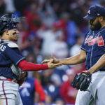 
              Atlanta Braves' William Contreras, left, celebrates the win with Atlanta Braves relief pitcher Kenley Jansen, right, following the ninth inning of a baseball game against the Philadelphia Phillies, Saturday, Sept. 24, 2022, in Philadelphia. The Braves won 6-3. (AP Photo/Chris Szagola)
            