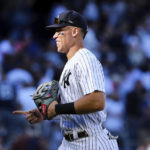 
              New York Yankees right fielder Aaron Judge gestures to his teammates after the defeated the Boston Red Sox in a baseball game Saturday, Sept. 24, 2022, in New York. (AP Photo/Jessie Alcheh)
            