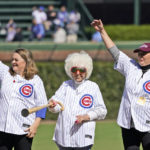 
              Actress Megan Cavanagh, left, who played Marla Hooch in the movie  "A League Of Their Own", Tracy Reiner, right, who played Betty "Spaghetti", stand with Maybelle Blair, an original member of the All-American Girls Professional Baseball League, during a 30th anniversary of the film shot a Wrigley Field, before a baseball game between the Chicago Cubs and the Philadelphia Phillies Thursday, Sept. 29, 2022, in Chicago. (AP Photo/Charles Rex Arbogast)
            