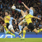 
              Manchester City's Erling Haaland, right, scores his side's 2nd goal during the group G Champions League soccer match between Manchester City and Borussia Dortmund at the Etihad stadium in Manchester, England, Wednesday, Sept. 14, 2022. (AP Photo/Dave Thompson)
            