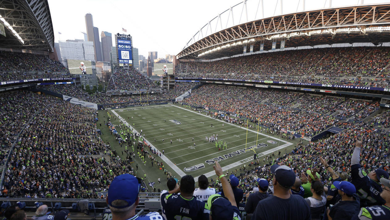 Fans cheer at Lumen Field during the second half of an NFL football game between the Seattle Seahaw...