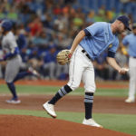 
              Tampa Bay Rays starting pitcher Shane McClanahan stands on the mound after giving up a two-run home run to the Toronto Blue Jays George Springer, behind, during the third inning of a baseball game Sunday, Sept. 25, 2022, in St. Petersburg, Fla. (AP Photo/Scott Audette)
            