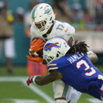 Buffalo Bills safety Damar Hamlin (3) tackles Miami Dolphins wide receiver Jaylen Waddle (17) during the second half of an NFL football game, Sunday, Sept. 25, 2022, in Miami Gardens, Fla. (AP Photo/Rebecca Blackwell)