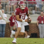 
              Oklahoma quarterback Dillon Gabriel (8) scrambles with the ball in the first half of an NCAA college football game against Kent State, Saturday, Sept. 10, 2022, in Norman, Okla. (AP Photo/Sue Ogrocki)
            