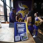 
              Cheerleaders for the The Minnesota Vikings meet supporters of the team at a fan interaction event at The Brotherhood Of Pursuits And Pastimes sports bar in Manchester, England, Wednesday, Sept. 28, 2022. A half-dozen NFL teams are aggressively targeting fans in Britain now that they have new marketing rights in the country. They’re signing commercial deals and hiring local media personalities in bids to expand their fanbases and tap international revenue. (AP Photo/Jon Super)
            