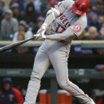 
              Los Angeles Angels Shohei Ohtani hits a fly ball in the first inning of a baseball game against the Minnesota Twins Saturday, Sept. 24, 2022, in Minneapolis. (AP Photo/Andy Clayton-King)
            