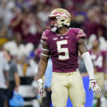 Florida State defensive lineman Jared Verse (5) reacts after sacking LSU quarterback Jayden Daniels in the first half of an NCAA college football game in New Orleans, Sunday, Sept. 4, 2022. (AP Photo/Gerald Herbert)