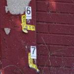 
              Evidence markers noting an apparent bullet holes are seen at the scene where multiple people were shot near Roxborough High School in Philadelphia, Wednesday, Sept. 28, 2022. (AP Photo/Matt Rourke)
            