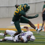 
              Baylor running back Taye McWilliams (22) breaks a tackle by Albany linebacker AJ Mistler (41) during the first half of an NCAA college football game in Waco, Texas, Saturday, Sept. 3, 2022. (AP Photo/LM Otero)
            