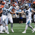 
              Carolina Panthers running back Christian McCaffrey celebrates after scoring with quarterback Baker Mayfield during the first half of an NFL football game against the Cleveland Browns on Sunday, Sept. 11, 2022, in Charlotte, N.C. (AP Photo/Jacob Kupferman)
            