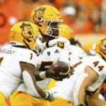 Arizona State fullback Case Hatch (44) rushes forward as quarterback Emory Jones (5) hands off to running back Xazavian Valladay (1) during the first half of an NCAA college football game against Oklahoma State, Saturday, Sept. 10, 2022, in Stillwater, Okla. (AP Photo/Brody Schmidt)